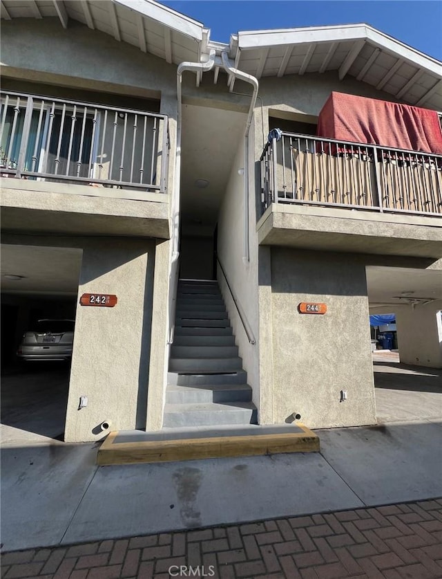 view of property featuring stairs