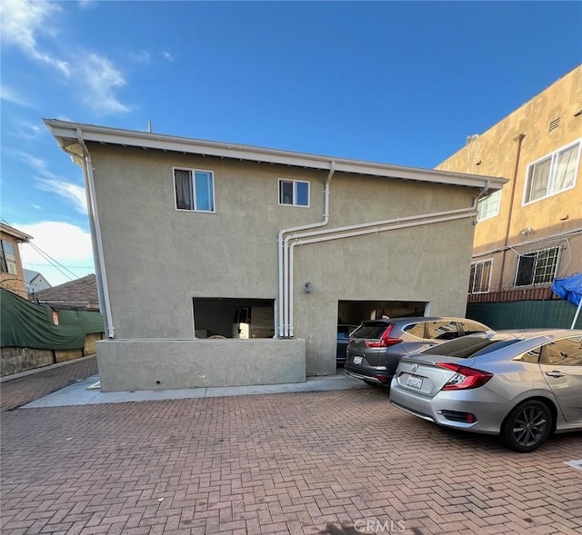back of property with stucco siding