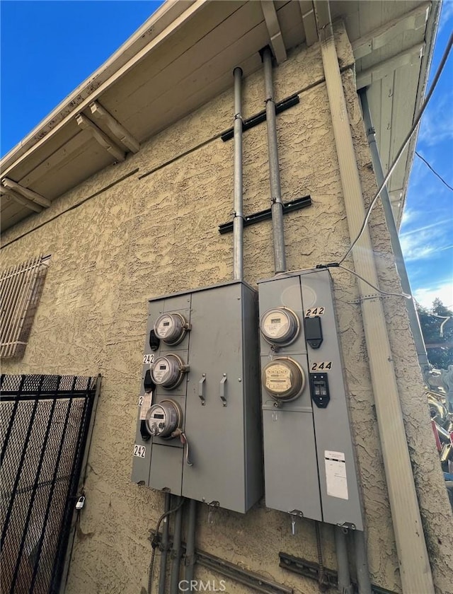 details with stucco siding and electric meter
