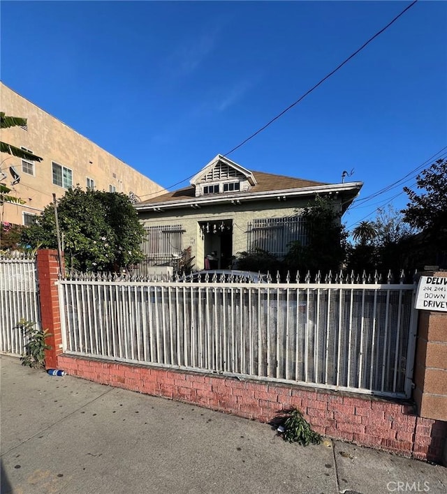 view of front of home with fence