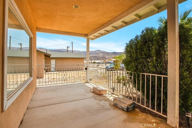 view of patio / terrace featuring a mountain view