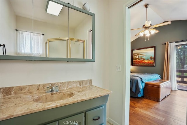 bathroom featuring lofted ceiling, hardwood / wood-style flooring, an enclosed shower, and a healthy amount of sunlight