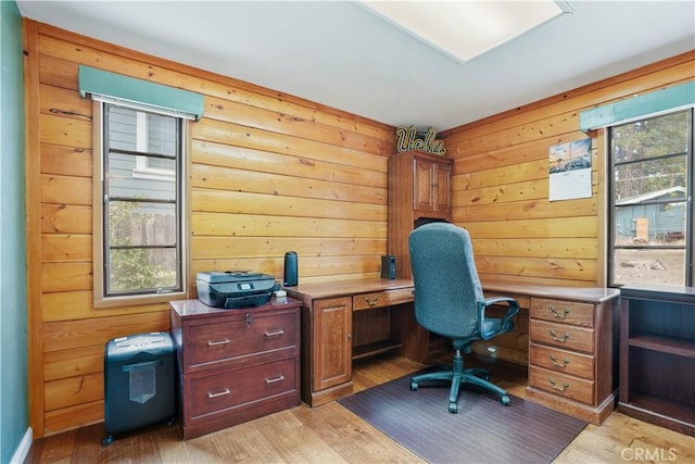 office area with light hardwood / wood-style floors and a wealth of natural light