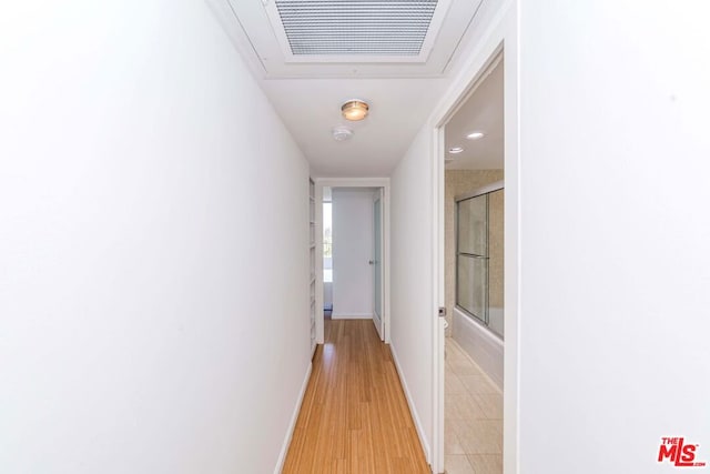 hall with light hardwood / wood-style flooring