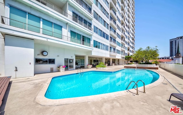 view of pool with a patio area