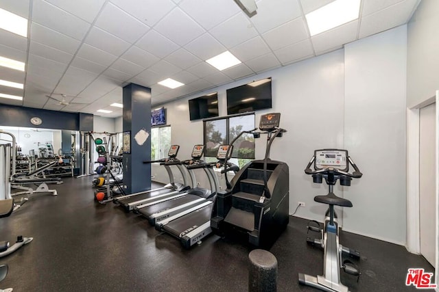 exercise room with a drop ceiling