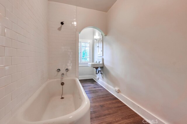 21457 Pecan St, Wildomar, CA 92595 - full bathroom featuring a bath and wood finished floors