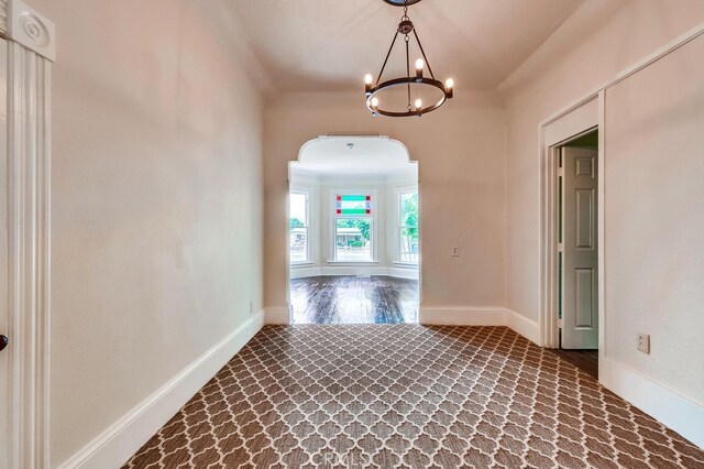 21457 Pecan St, Wildomar, CA 92595 - hallway featuring a chandelier and arched walkways