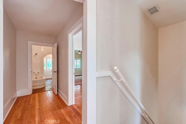 21457 Pecan St, Wildomar, CA 92595 - corridor featuring an upstairs landing and light wood finished floors