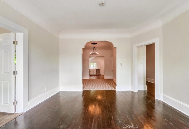 21457 Pecan St, Wildomar, CA 92595 - spare room featuring arched walkways, wood finished floors, and a smoke detector