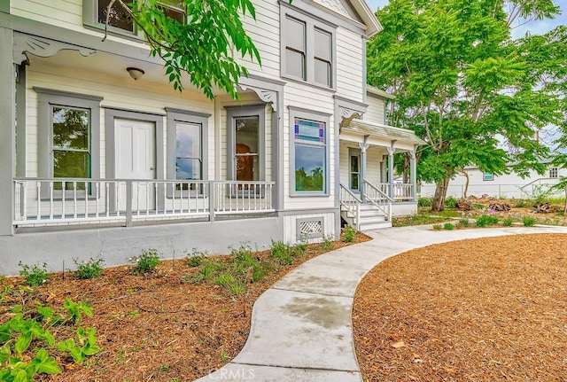 doorway to property featuring a porch