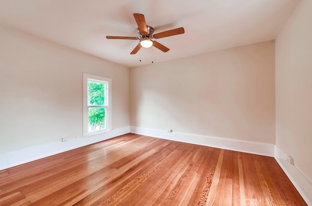 spare room featuring ceiling fan and hardwood / wood-style flooring