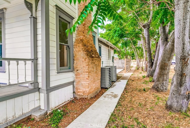 view of side of home featuring central AC