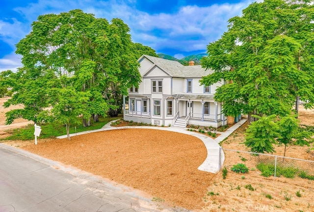 victorian-style house with covered porch