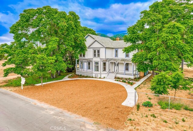 21457 Pecan St, Wildomar, CA 92595 - victorian home featuring covered porch, a chimney, and a shingled roof
