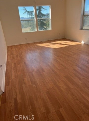 spare room featuring light hardwood / wood-style flooring