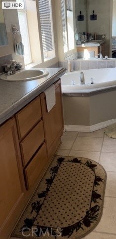 bathroom with tile patterned floors and sink