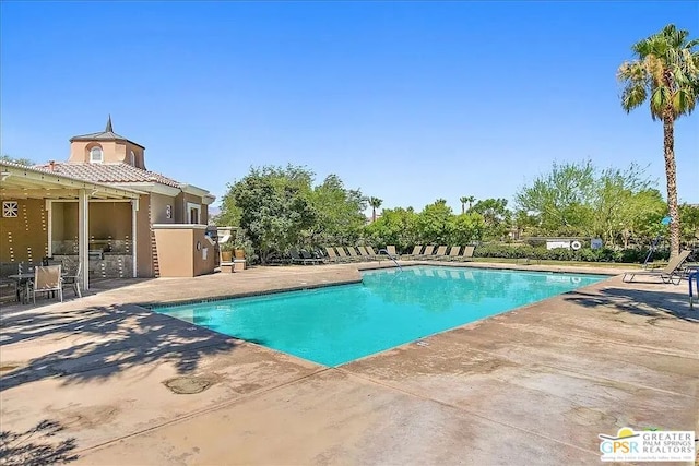 view of pool featuring a patio area