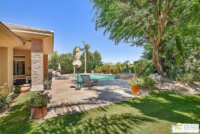 exterior space featuring a pool with hot tub