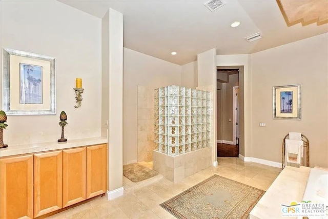 bathroom with vanity and tile patterned floors