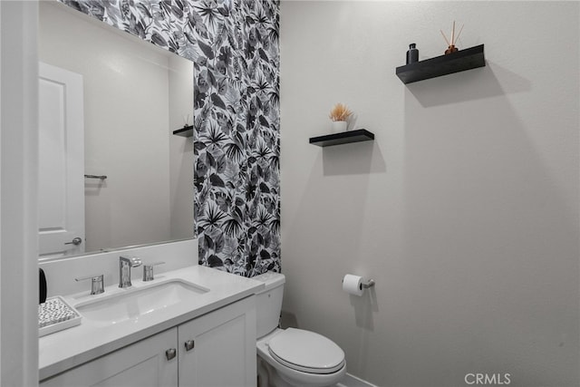 bathroom with vanity and toilet