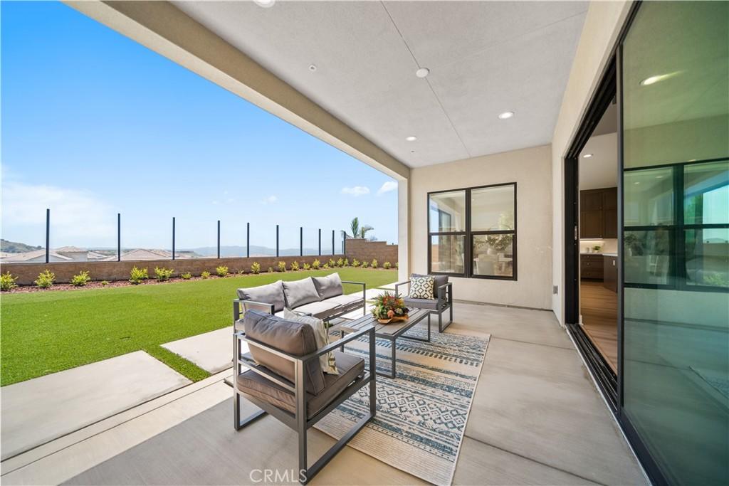 view of patio featuring an outdoor living space and fence