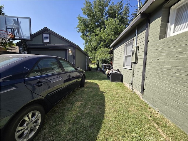 view of side of property with a yard