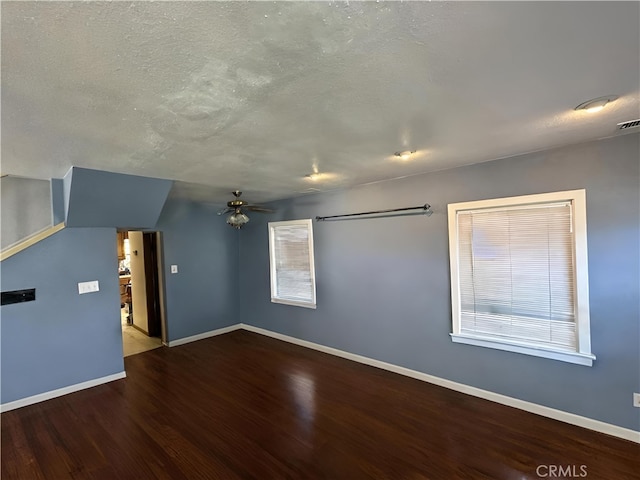 unfurnished living room featuring hardwood / wood-style floors, a textured ceiling, and ceiling fan