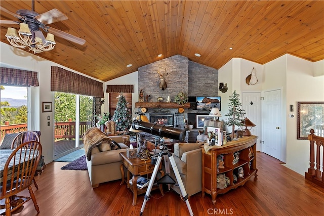 living room with wood ceiling, hardwood / wood-style floors, ceiling fan, high vaulted ceiling, and a fireplace