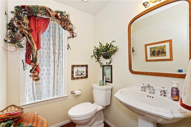 bathroom featuring toilet and sink