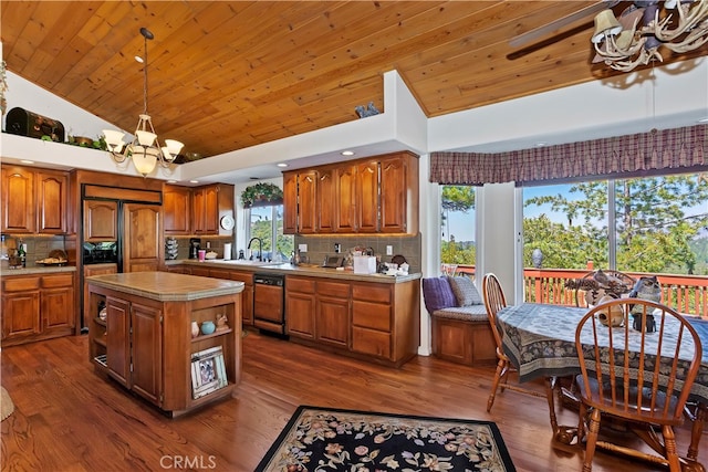 kitchen featuring dark wood-type flooring, a healthy amount of sunlight, and a kitchen island