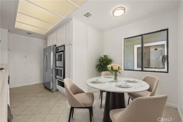 dining space with light tile patterned floors