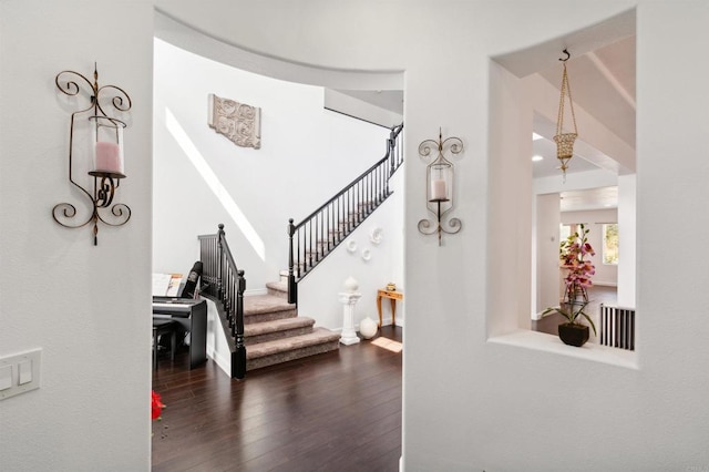 stairway featuring hardwood / wood-style floors