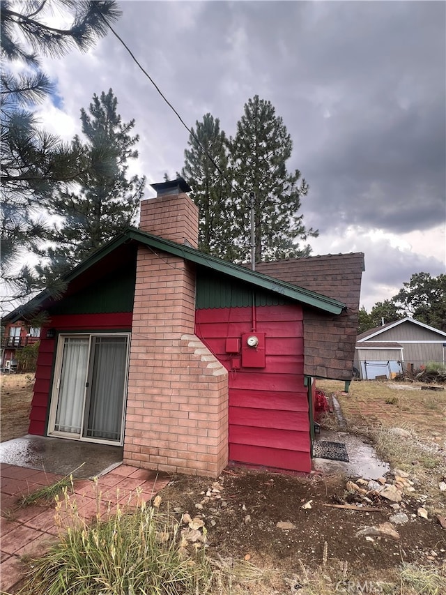 view of home's exterior featuring a garage and an outdoor structure