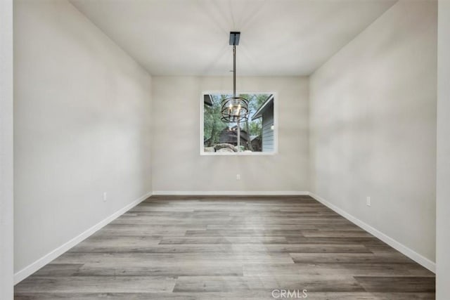 unfurnished dining area with hardwood / wood-style flooring