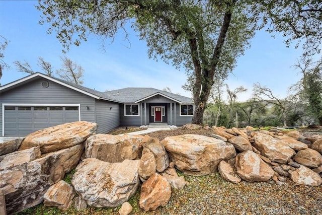 ranch-style home featuring a garage