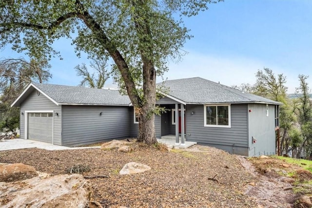 ranch-style house featuring a garage