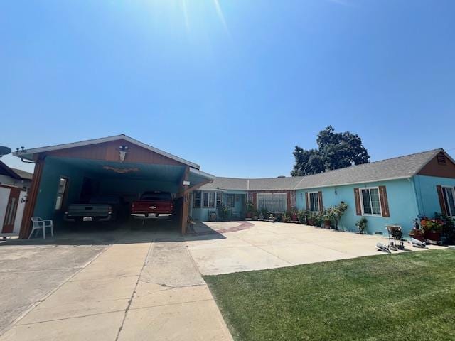 single story home featuring a front yard and a carport