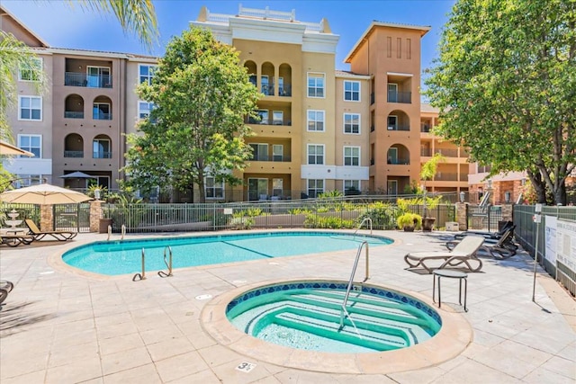 view of pool featuring a community hot tub