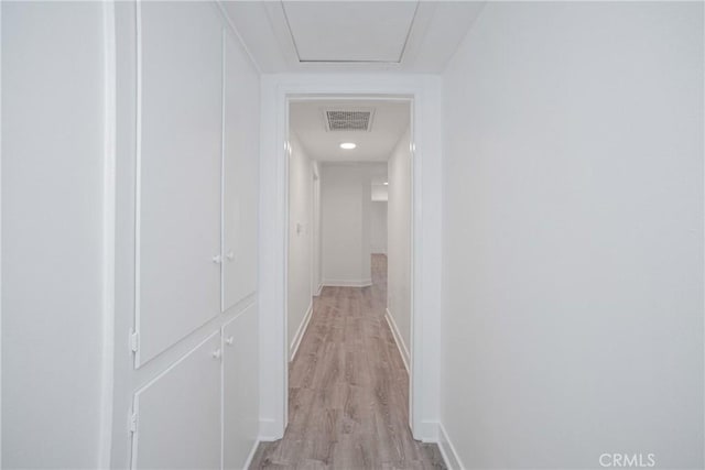 corridor with light wood-type flooring