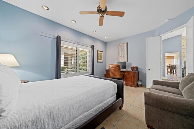 bedroom with ceiling fan and light tile patterned floors