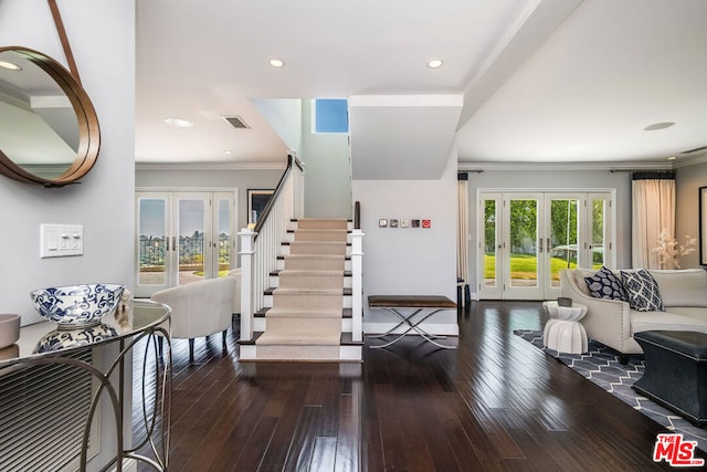 entryway featuring crown molding, french doors, and dark wood-type flooring