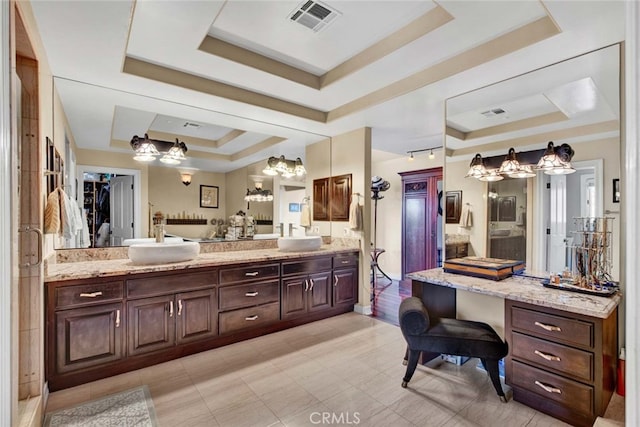 bathroom featuring vanity and a raised ceiling