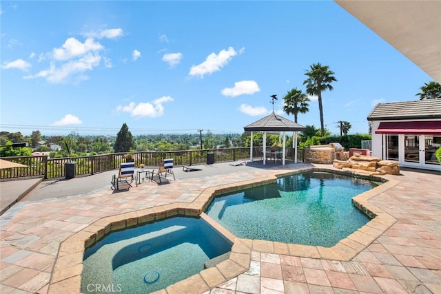 view of swimming pool with a gazebo, an in ground hot tub, and a patio area