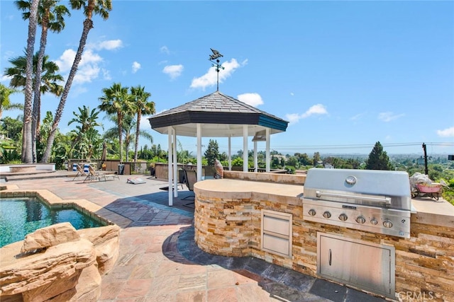 view of patio with a gazebo, area for grilling, and an outdoor kitchen