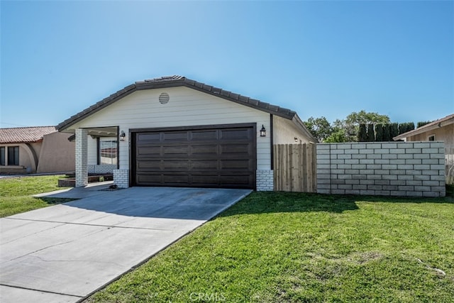 view of front of home with a garage and a front lawn