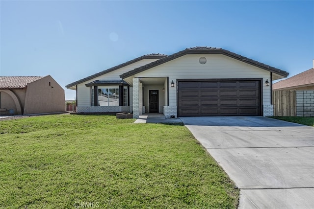 ranch-style home with a garage and a front lawn