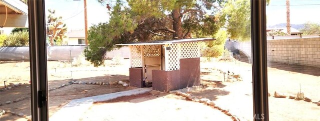 view of patio featuring fence