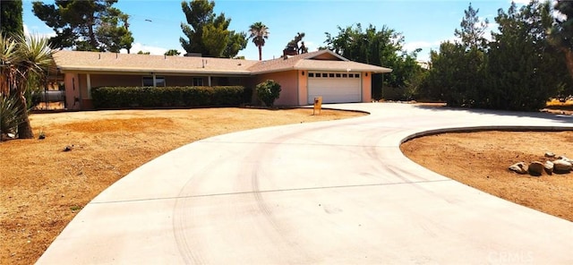 ranch-style house featuring a garage