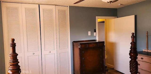 bedroom featuring a textured ceiling, a closet, and ceiling fan